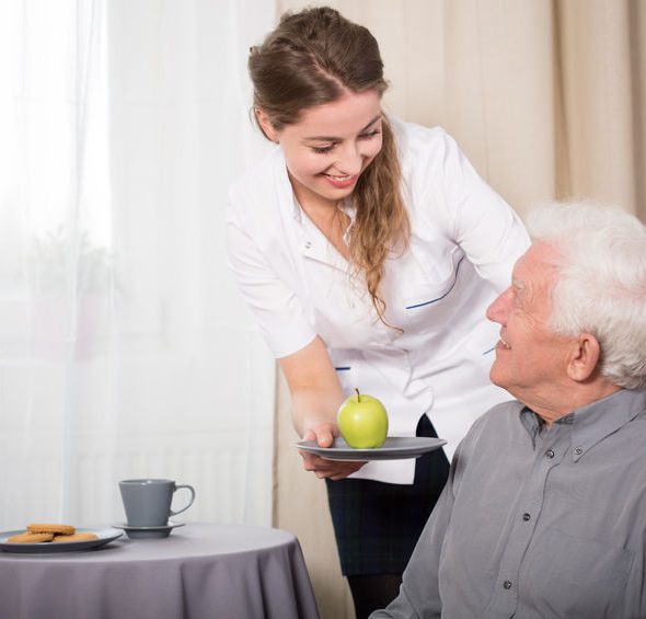 Betreuerin mit Patient